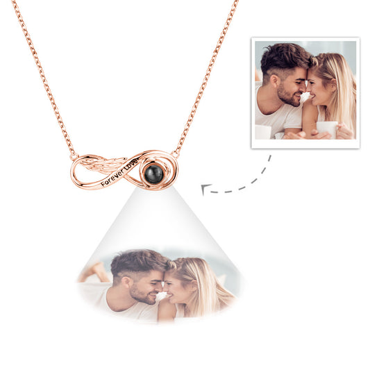 Personalized infinity projection necklace engraved with "Eternal Love" in silver
