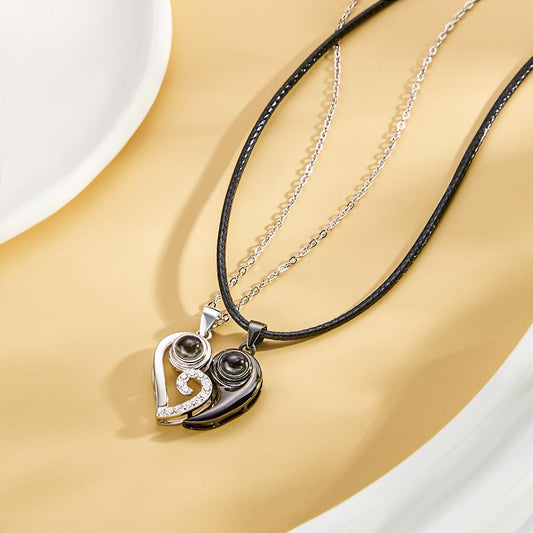 Two personalized heart-shaped projection necklaces