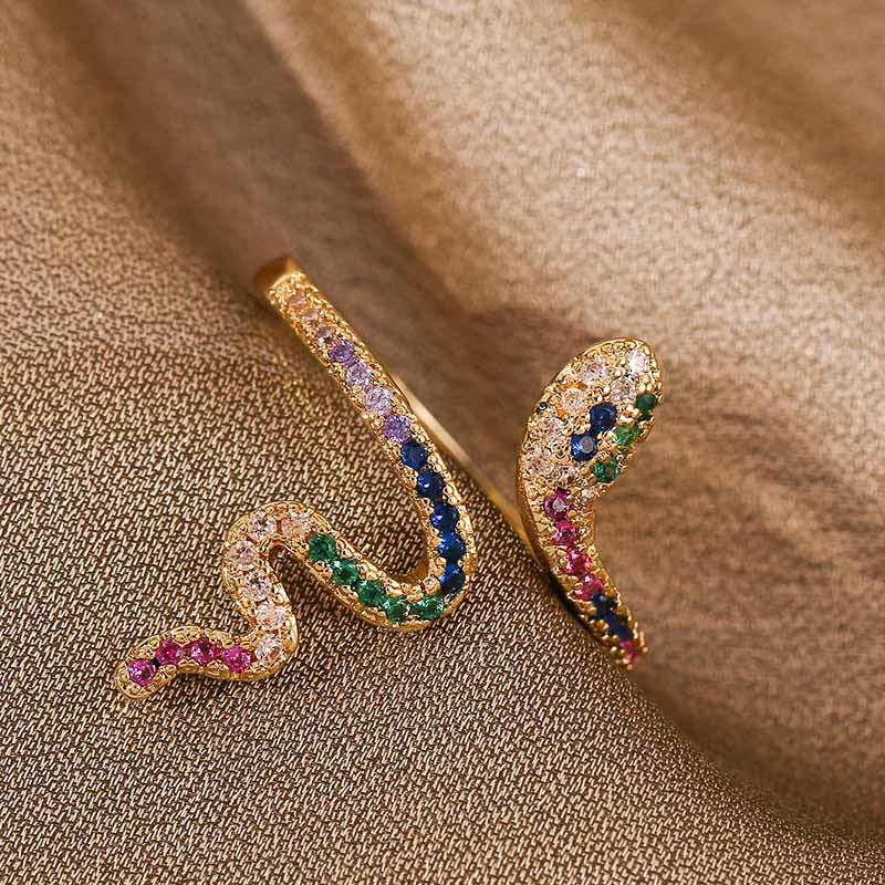 Adjustable ring in zircon and copper with a snake motif