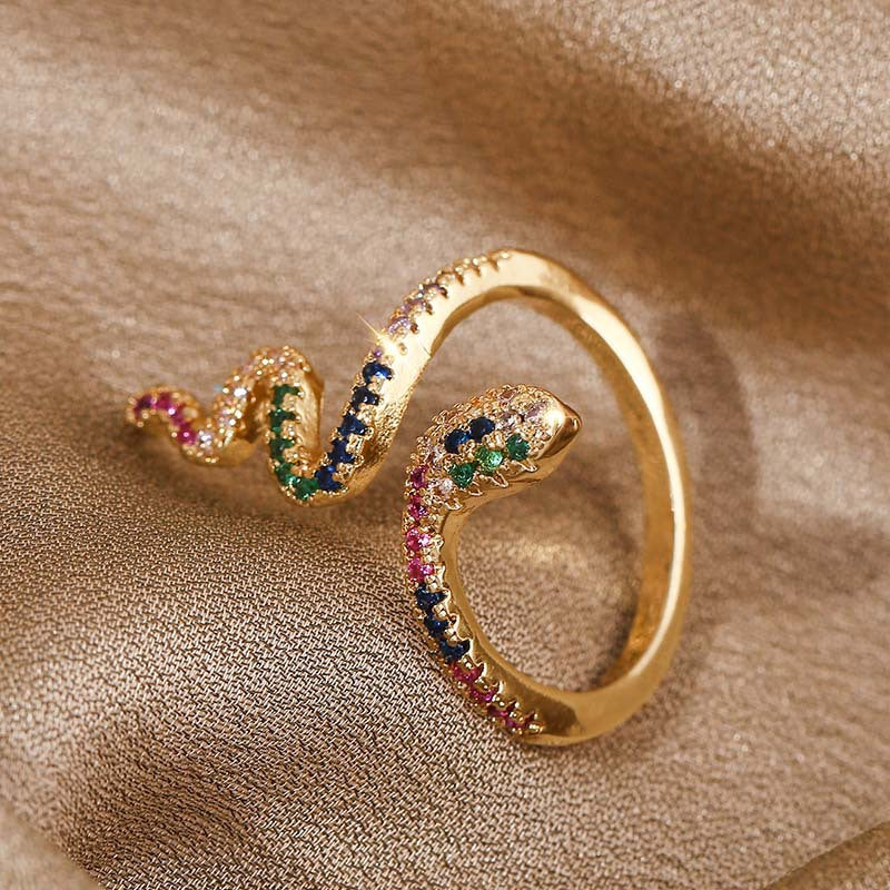Adjustable ring in zircon and copper with a snake motif