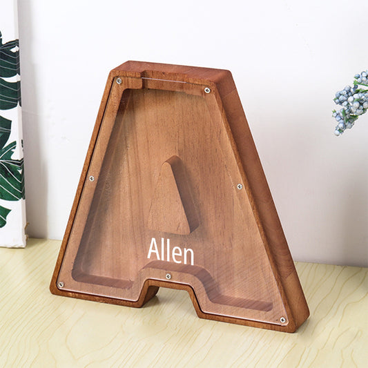 Personalized wooden piggy bank with 26 letters and first name.