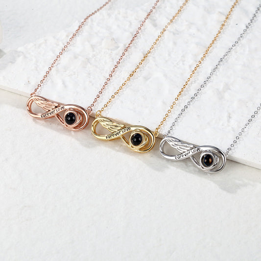 Personalized infinity projection necklace engraved with "Eternal Love" in silver