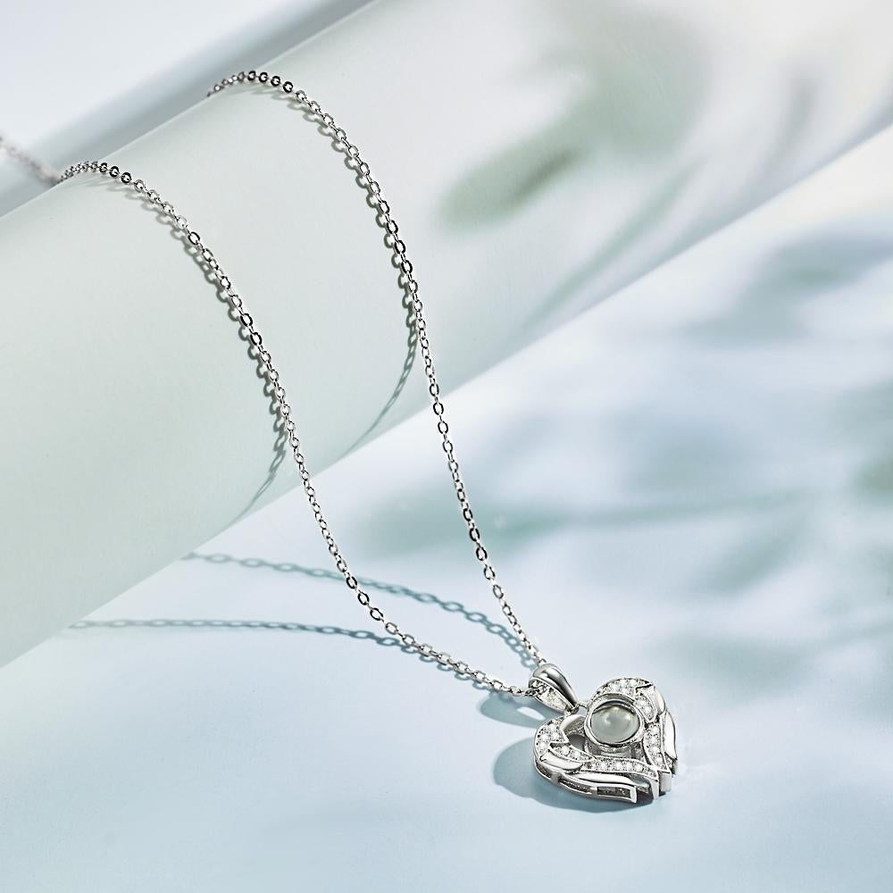Personalized necklace with photo projection of angel wings