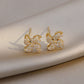 Earrings shaped like a small rotating windmill