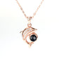 Personalized necklace with dolphin projection and diamonds